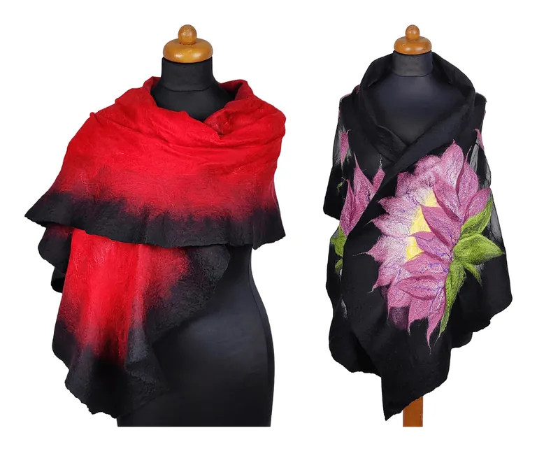 Two finished felted silk shawls on dress forms: a red shawl with a rippled black edge, and a black shawl with a pink lotus flower